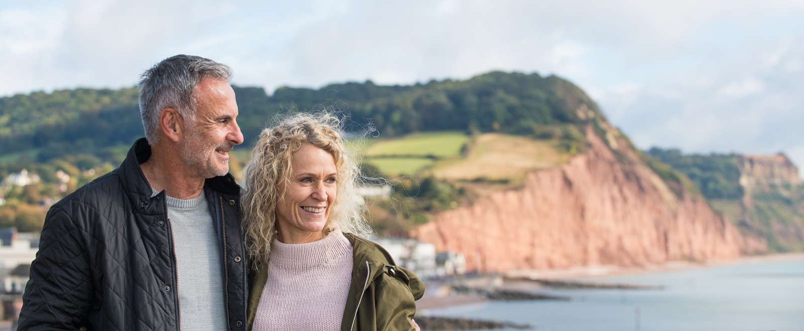 Close Up of couple Walking Along Jurassic Coast