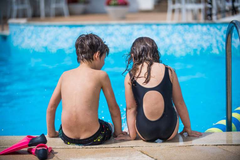 Victoria Hotel Children Sitting on Edge of Outdoor Pool