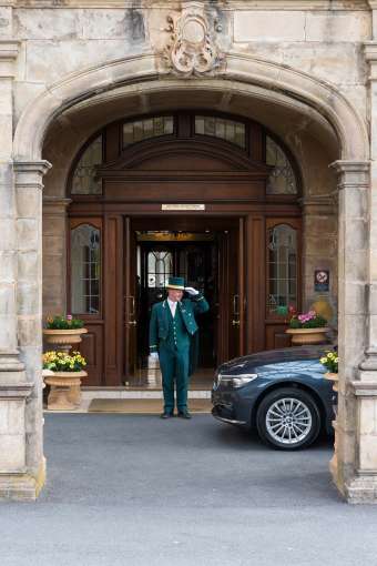 Victoria Hotel Doorman Greeting Arriving Car