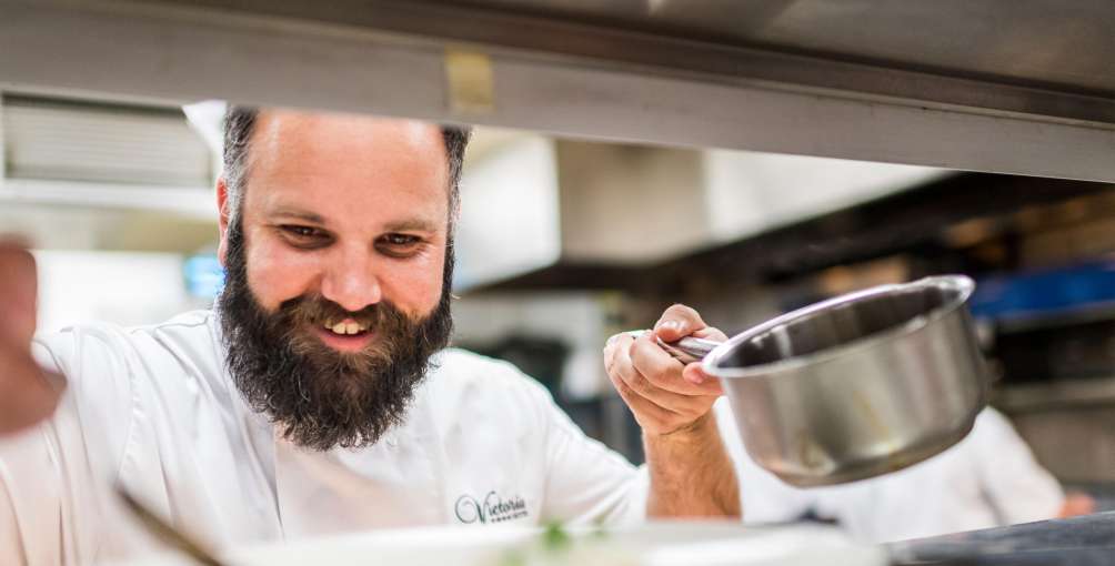 Head Chef Stuart White at The Victoria Hotel in Sidmouth preparing dinner in the restaurant kitchen