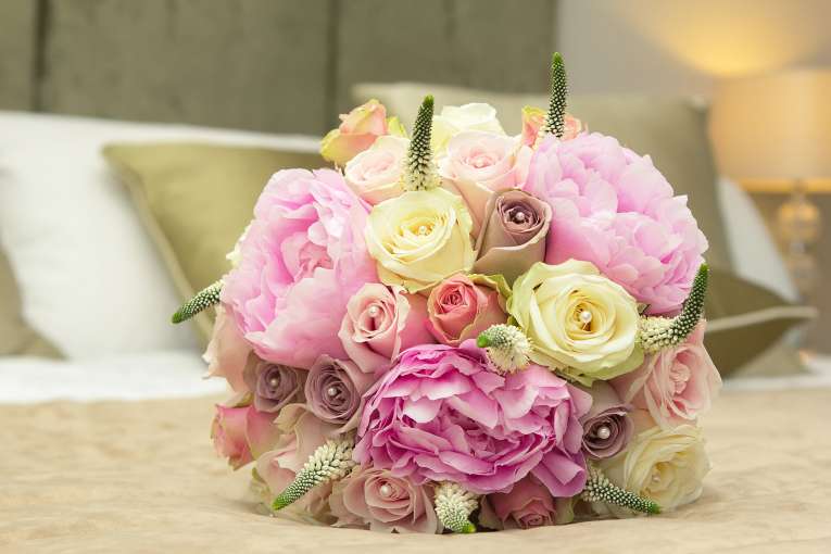 Brides Bouquet on Hotel Bed