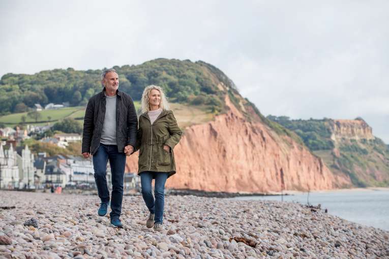 Couple Walking Along Jurassic coast