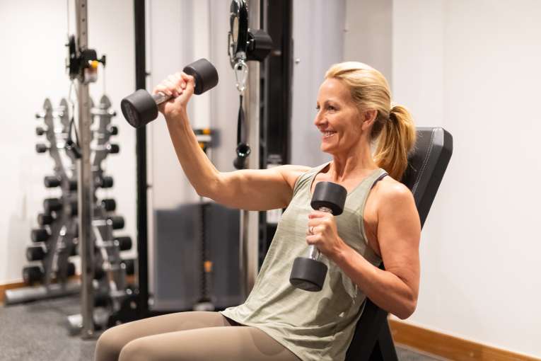 Women holding weight in gym 